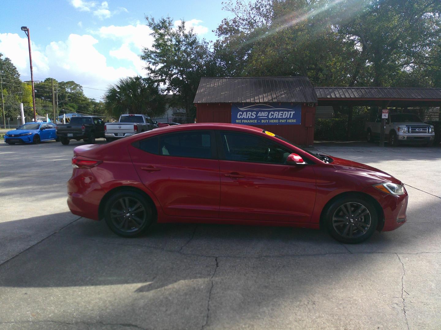 2017 RED HYUNDAI ELANTRA LIMITED; SE (5NPD84LF2HH) , located at 1200 Cassat Avenue, Jacksonville, FL, 32205, (904) 695-1885, 30.302404, -81.731033 - Photo#4